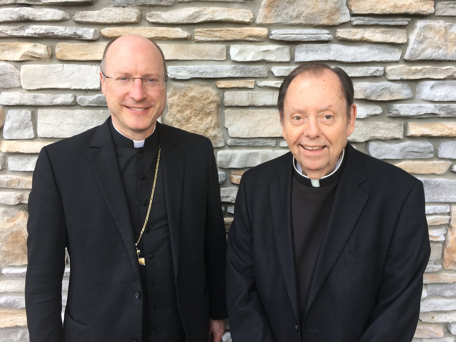 Bishop W. Shawn McKnight visits Monsignor Michael J. Wilbers.